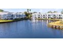 Community features a waterfront view with a fountain in the middle of the lake at 2516 Woodgate Blvd # 206, Orlando, FL 32822