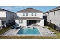 Home with private pool, spa, patio furniture, and fenced backyard at 289 Auburn Ave, Kissimmee, FL 34747