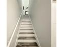 Modern staircase with gray and white wood at 3383 Westchester Square Blvd # 202, Orlando, FL 32835