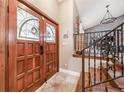 Elegant entry with double doors, stained glass, and a staircase with iron railing at 2351 Westwood Dr, Longwood, FL 32779