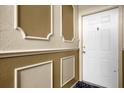 Building entryway with white door and decorative wall at 4008 Versailles Dr # 4008C, Orlando, FL 32808