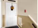 Condo entry with white door and autumn decor at 4121 Dijon Dr # 4121H, Orlando, FL 32808