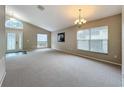 Bright and airy living room with neutral walls and carpet at 425 Tree Shore Dr, Orlando, FL 32825