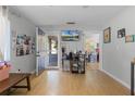 Living area showcasing hardwood floors and views into other rooms at 15 Volusia Dr, Debary, FL 32713