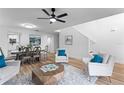 Open concept dining area with hardwood floors and stylish furnishings at 333 Fairfield Dr, Sanford, FL 32771