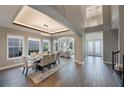 Spacious dining room with hardwood floors and modern light fixture at 3867 Grassland Loop, Lake Mary, FL 32746