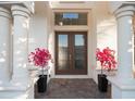 Elegant entryway with double doors and lush landscaping at 3867 Grassland Loop, Lake Mary, FL 32746