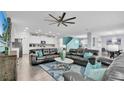 Spacious living room with comfortable seating and a large TV at 1840 Caribbean View Ter, Kissimmee, FL 34747