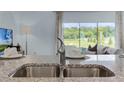 Stainless steel kitchen sink with granite countertop at 3313 Private Oak Dr, Apopka, FL 32703