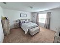 Spacious bedroom with carpeted floors and ample natural light at 604 Madison Dr, Davenport, FL 33837