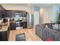 Modern kitchen with stainless steel appliances and granite countertops at 604 Madison Dr, Davenport, FL 33837