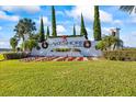 Lakeshore community entrance sign with festive holiday decorations at 15636 Shorebird Ln, Winter Garden, FL 34787