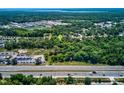 Property location shown from above, near a highway at 4750 N Ronald Reagan Blvd, Sanford, FL 32771