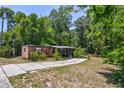 Single-wide mobile home with a small yard at 4750 N Ronald Reagan Blvd, Sanford, FL 32771