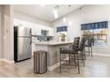 Community kitchen with stainless steel appliances and breakfast bar at 3038 Parkway Blvd # 302, Kissimmee, FL 34747