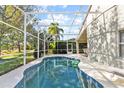 Refreshing pool with a screened enclosure at 422 Troon Cir, Davenport, FL 33897