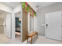 Bright and airy entryway with a bench, mirror, and view of the bedroom at 4322 Lana Ave, Davenport, FL 33897