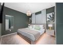 Spacious main bedroom with a king-size bed, neutral decor, and a walk-in closet at 4322 Lana Ave, Davenport, FL 33897