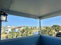 Covered balcony offering scenic views of the neighborhood at 8035 Surf St, Kissimmee, FL 34747