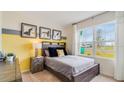 Cozy bedroom with large window, providing ample natural light at 1296 Hanoverian Dr, Lake Alfred, FL 33850