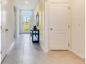 Bright and spacious foyer with tile flooring and access to other rooms at 1296 Hanoverian Dr, Lake Alfred, FL 33850