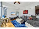 Spacious living room with comfortable sectional sofa and hardwood floors at 155 S Court Ave # 1602, Orlando, FL 32801