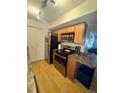 Modern kitchen featuring stainless steel appliances and light wood cabinetry at 2810 Plaza Terrace Dr # 2810, Orlando, FL 32803