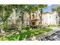 Attractive condo building with lush landscaping and convenient parking at 831 Camargo Way # 203, Altamonte Springs, FL 32714