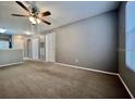Bright living room featuring neutral walls and carpet at 831 Camargo Way # 203, Altamonte Springs, FL 32714