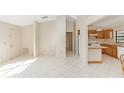 Open kitchen with light wood cabinets and tile floor at 1073 Humphrey Blvd, Deltona, FL 32738