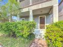 Front entrance with a covered porch and well-maintained landscaping at 12285 Joshua Tree Trl, Windermere, FL 34786