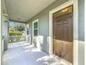 Covered front porch with access to the front door at 12285 Joshua Tree Trl, Windermere, FL 34786