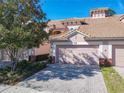 Two-story townhome with attached garage and paved driveway at 1300 Gilford Point Ln # 1300, Davenport, FL 33896