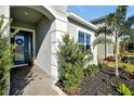 Inviting front entrance with a blue door and walkway at 3359 Hanging Tide St, Winter Garden, FL 34787