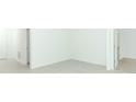 Empty room with tiled floor, white walls, and doors to other rooms at 5021 Bougainvillea Ct, Lake Hamilton, FL 33851