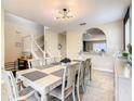 Bright dining room with a large table and an open concept design at 5303 Wildwood Way, Davenport, FL 33837