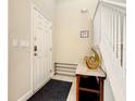Front entry with staircase, shoe storage, and decorative accents at 5303 Wildwood Way, Davenport, FL 33837