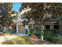 Two-story townhome with garage and manicured landscaping at 659 Fortanini Cir, Ocoee, FL 34761