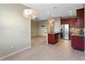 Modern kitchen with stainless steel appliances and granite countertops at 659 Fortanini Cir, Ocoee, FL 34761