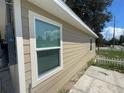 Side view of tan house with window and white trim at 1170 S Central Ave, Apopka, FL 32703