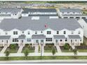 Aerial perspective showcasing a row of townhomes in a residential community at 14035 Lochend Way, Winter Garden, FL 34787