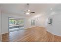 Spacious living room featuring new flooring and lots of natural light at 3004 E Beaumont Ln, Eustis, FL 32726