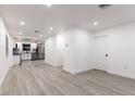 Bright and airy living room with modern gray vinyl flooring and recessed lighting at 3149 W Washington St, Orlando, FL 32805