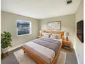 Spacious bedroom with light walls and a large window at 317 Florida Pkwy, Kissimmee, FL 34743