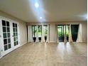 Bright living room with tile floors and sliding doors to the outdoors at 423 Sheoah Blvd # 19, Winter Springs, FL 32708