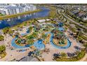 Aerial view of community pool, lazy river, and other amenities at 4721 Clock Tower Dr # 204, Kissimmee, FL 34746