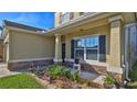 Inviting front porch with landscaping and stone accents at 5344 Peach Blossom Blvd, Port Orange, FL 32128