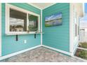 Outdoor bar area with granite countertop and a scenic view at 12071 Lakeshore Way, Oxford, FL 34484