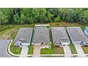 An aerial view showcasing a row of single-Gathering homes in a residential neighborhood at 2069 Canton Park Dr, Winter Haven, FL 33881