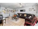 Spacious living room with leather sectional sofa and large TV at 2310 Fairgren Ave, Deltona, FL 32738